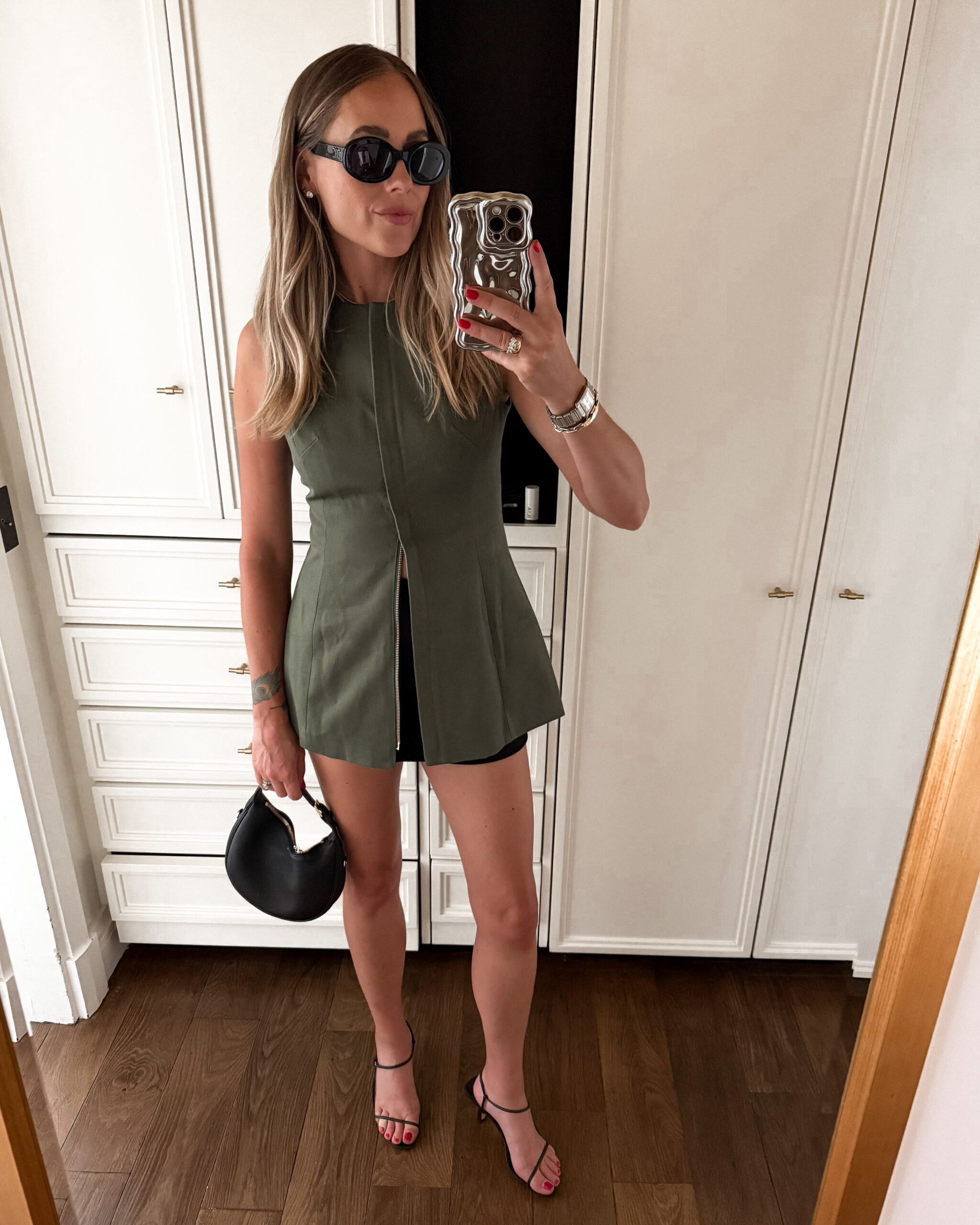 Fashion Jackson Wearing Tuckernuck Long Green Vest Black skort Black Heeled sandals Celine Teen Lulu Black Handbag Summer Paris Outfit