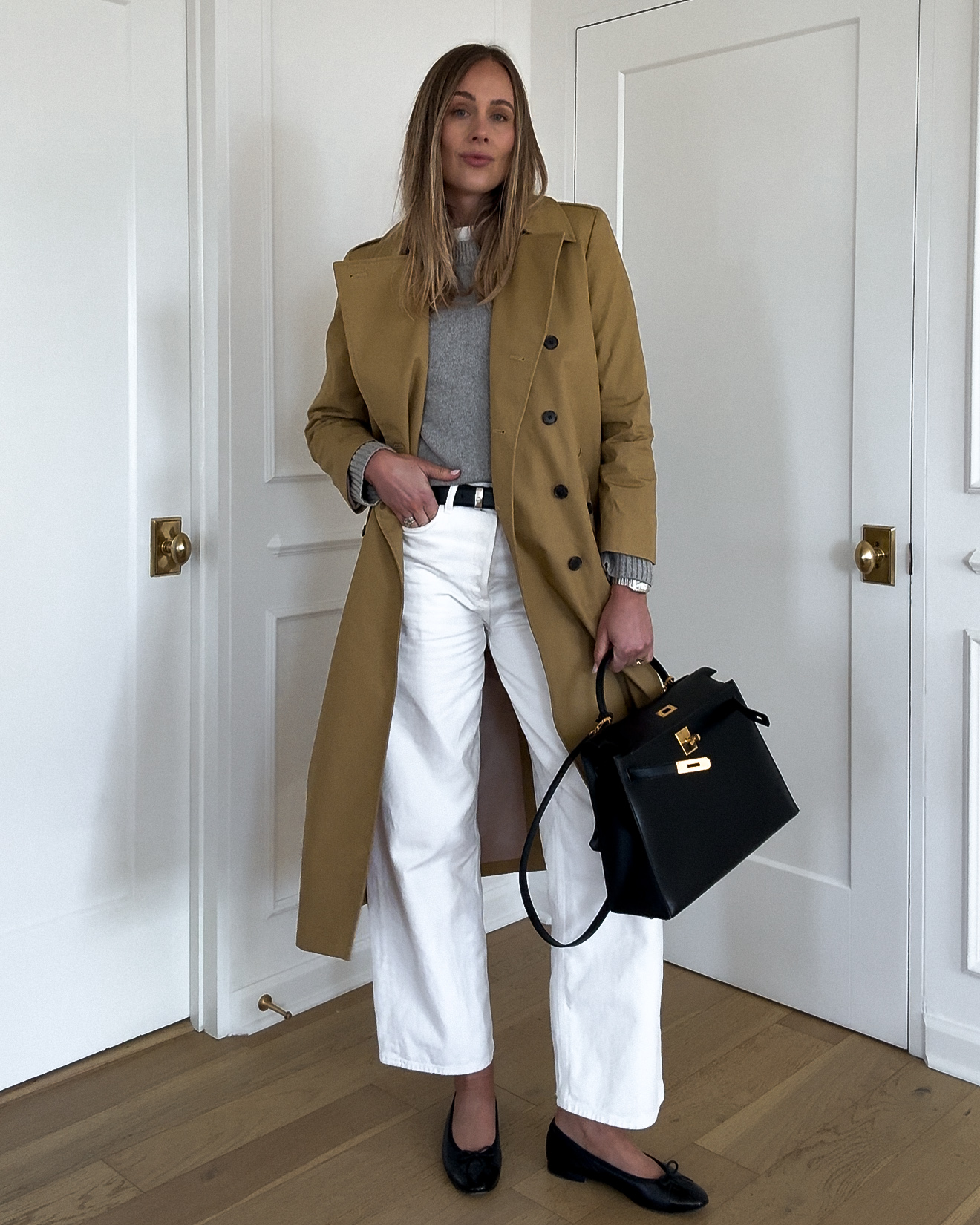 fashion jackson wearing jcrew trench coat AGOLDE white jeans grey sweater chanel black ballerina flats hermes black kelly spring outfit